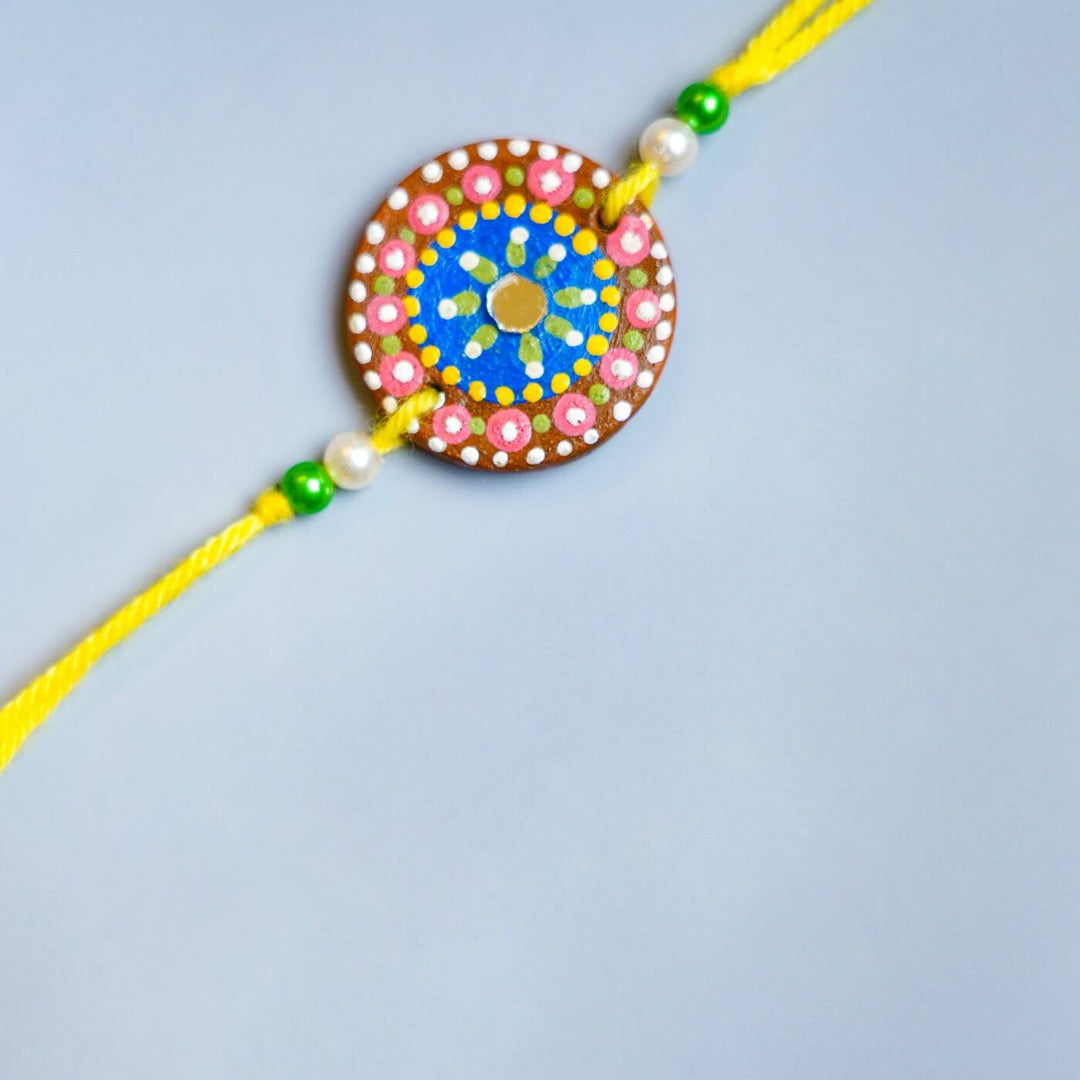 Handpainted Terracotta Rakhi & Mug Set with Roli Chawal