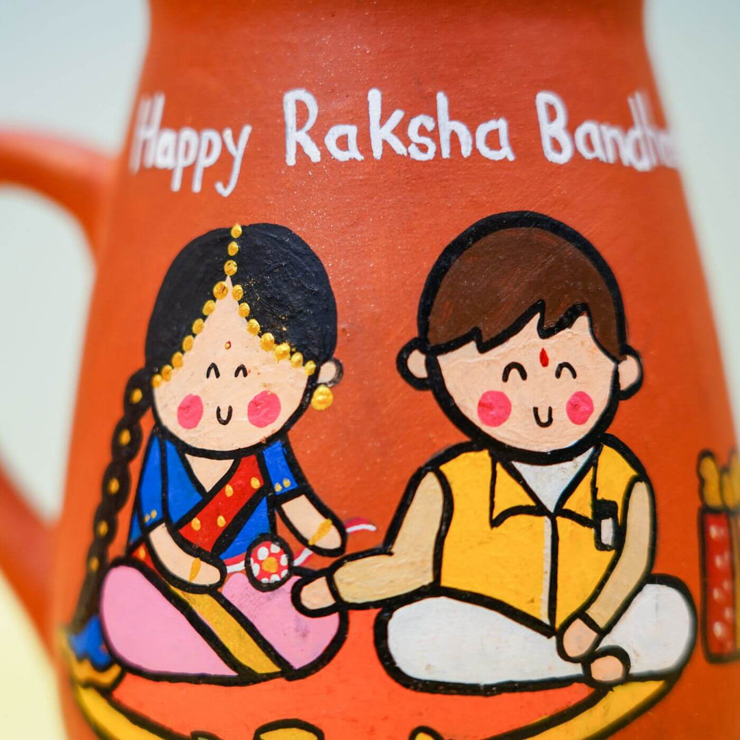 Handpainted Terracotta Rakhi & Mug Set with Roli Chawal