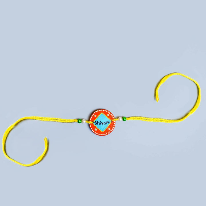 Personalized Terracotta Blue & Orange Rakhi With Roli Chawal