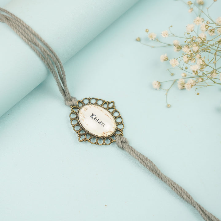 Photo Personalized Handmade Oval Antique Bronze Rakhi With Roli Chawal Copy - Close-up of Personalized Bracelet