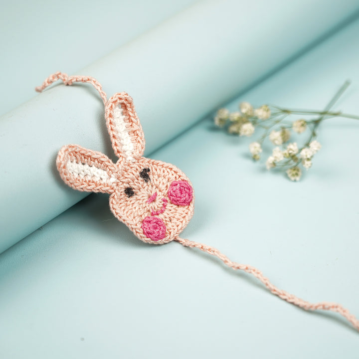 Handmade Crochet Bunny Theme Kids Rakhi With Roli Chawal - Side View Showing Depth (5)
