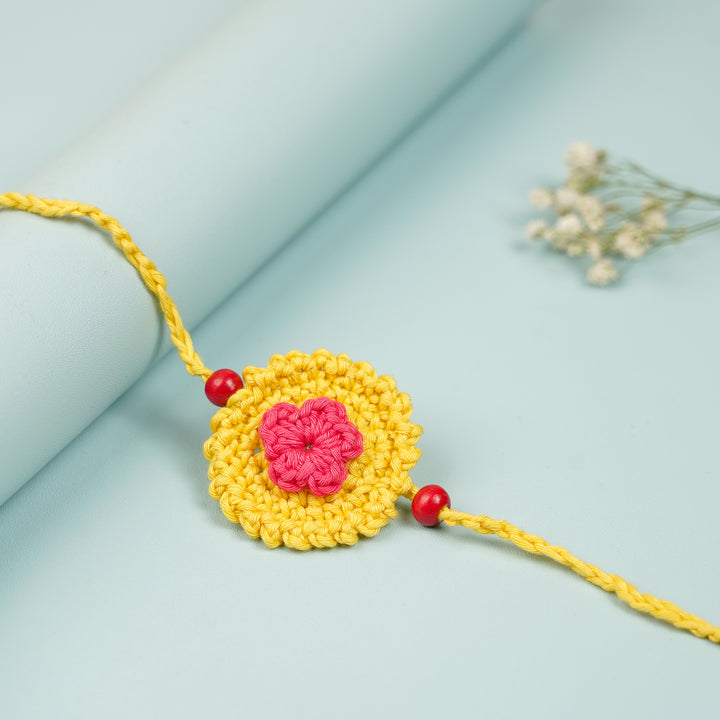 Handmade Crochet Round Mini Floral Rakhi With Roli Chawal - Close-up of single rakhi variant