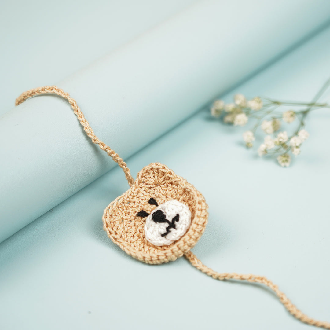 Handmade Crochet Bear Kids Rakhi With Roli Chawal - Close-up Front View
