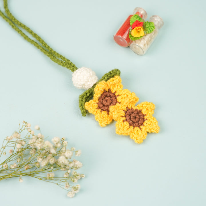 Handmade Crochet Sunflower Lumba Rakhi For Bhabhi With Roli Chawal - Top view with additional decor