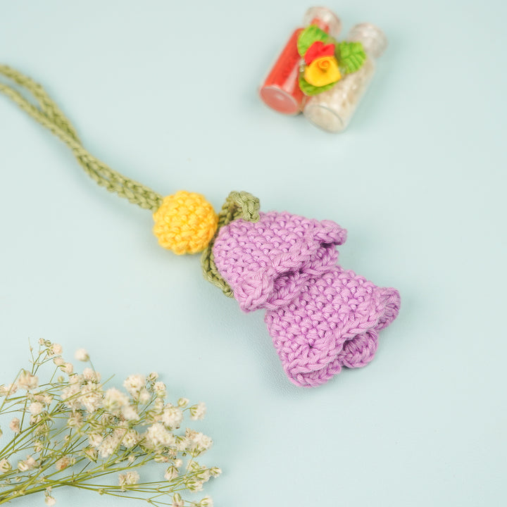 Handmade Crochet Tulip Lumba Rakhi For Bhabhi With Roli Chawal - Front View with Background Props
