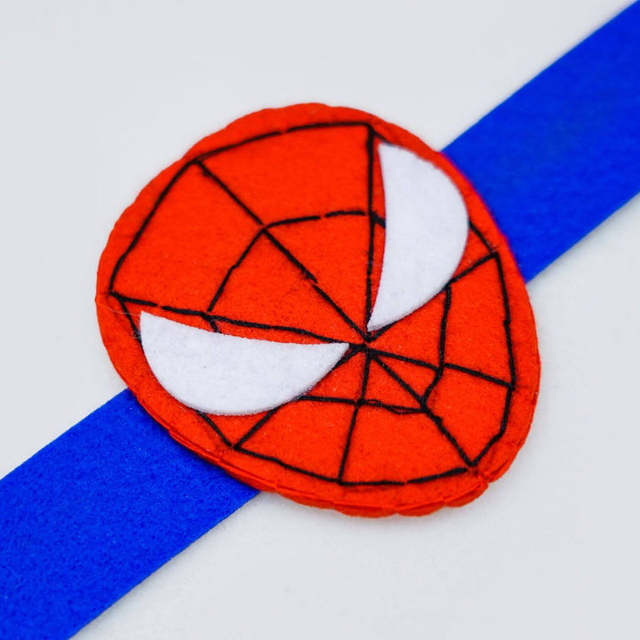 Kids Theme Felt Rakhi Band With Roli Chawal 1 - Close-up of Spiderman Emblem