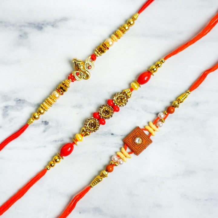 Embroidered Personalized Towel Rakhi Hamper 2 - Close-up of Three Decorative Rakhis