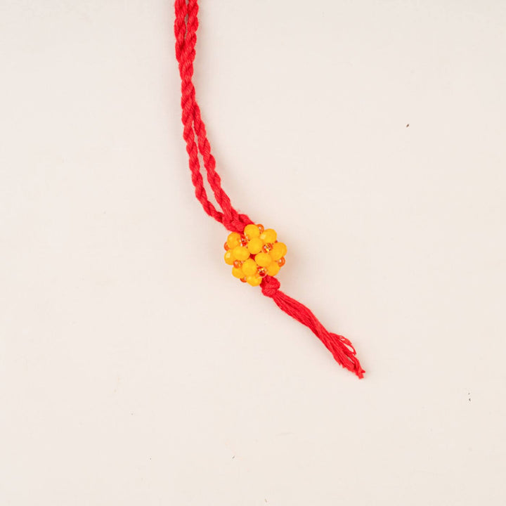 Handcrafted Glass Beads Lumba Rakhi 1 - Yellow Beaded Close-up