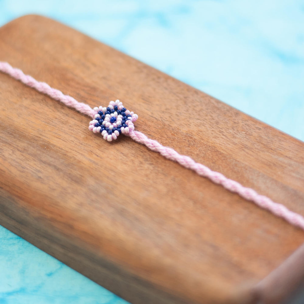 Phool Collection Glass Beeds Rakhi Pink Blue - Close-up of beaded bracelet detail