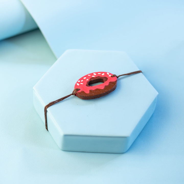 Handpainted Wooden Rakhi Cupcake - Close-up on Donut Bracelet