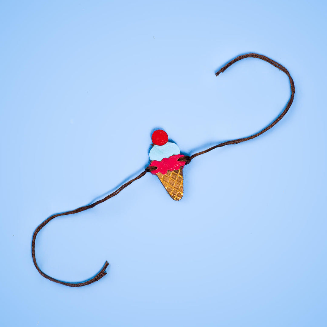 Handpainted Wooden Rakhi Icecream - Bracelet Laid Out Flat