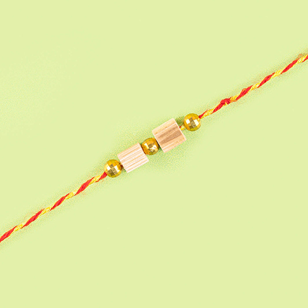 Ecofriendly Two Square Beads Bamboo Rakhi With Roli Chawal - Close-up of beaded bracelet detail