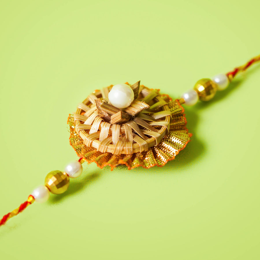 Ecofriendly Bamboo Rakhi With Pearl Beads Gota - Close-up of decorative rakhi