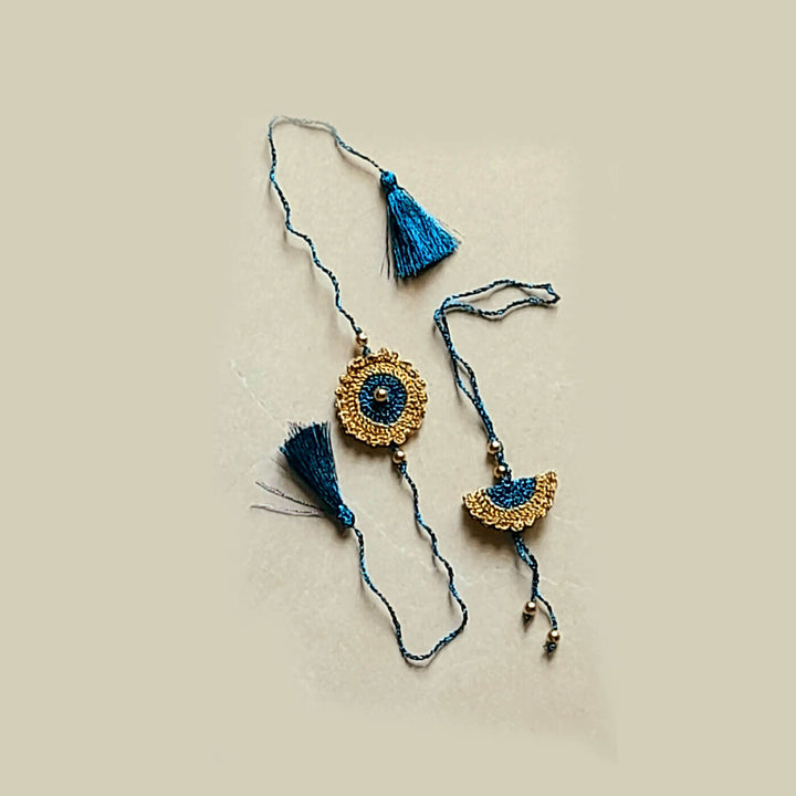 Peacock Blue Gold Bhaiya Bhabhi Lumba Rakhi Set - Laid Flat on Surface