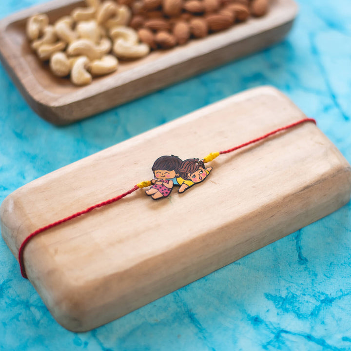 Handpainted Sibling Illustration Rakhi With Roli Chawal