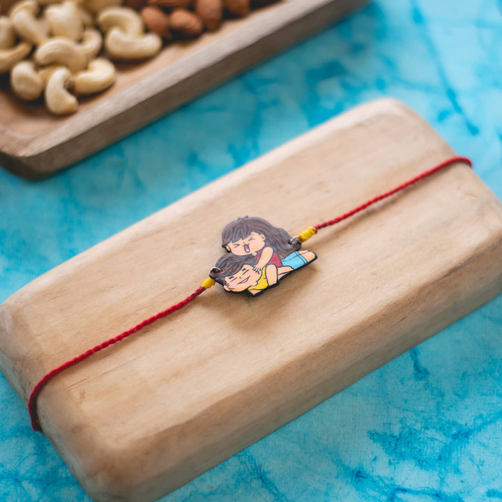 Handpainted Sibling Illustration Rakhi With Roli Chawal