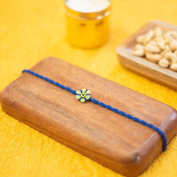 Phool Collection Glass Beeds Rakhi Indigo - Styled Product Display with Background Props