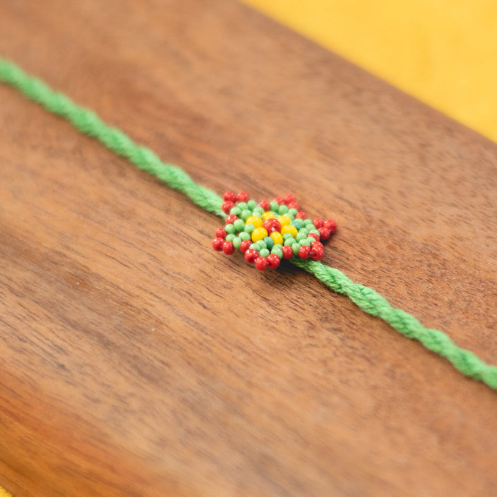 Sitara Collection Glass Beeds Rakhi Green - Close-up of beaded detail