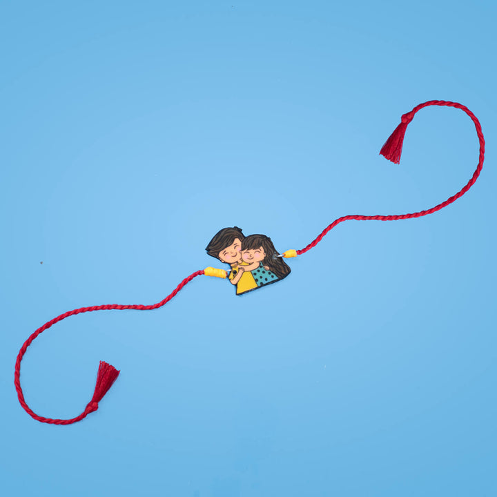 Handpainted Sibling Illustration Rakhi With Roli Chawal