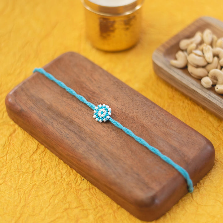Chaand Collection Glass Beeds Rakhi Sky Blue - Styled Product Display with Props