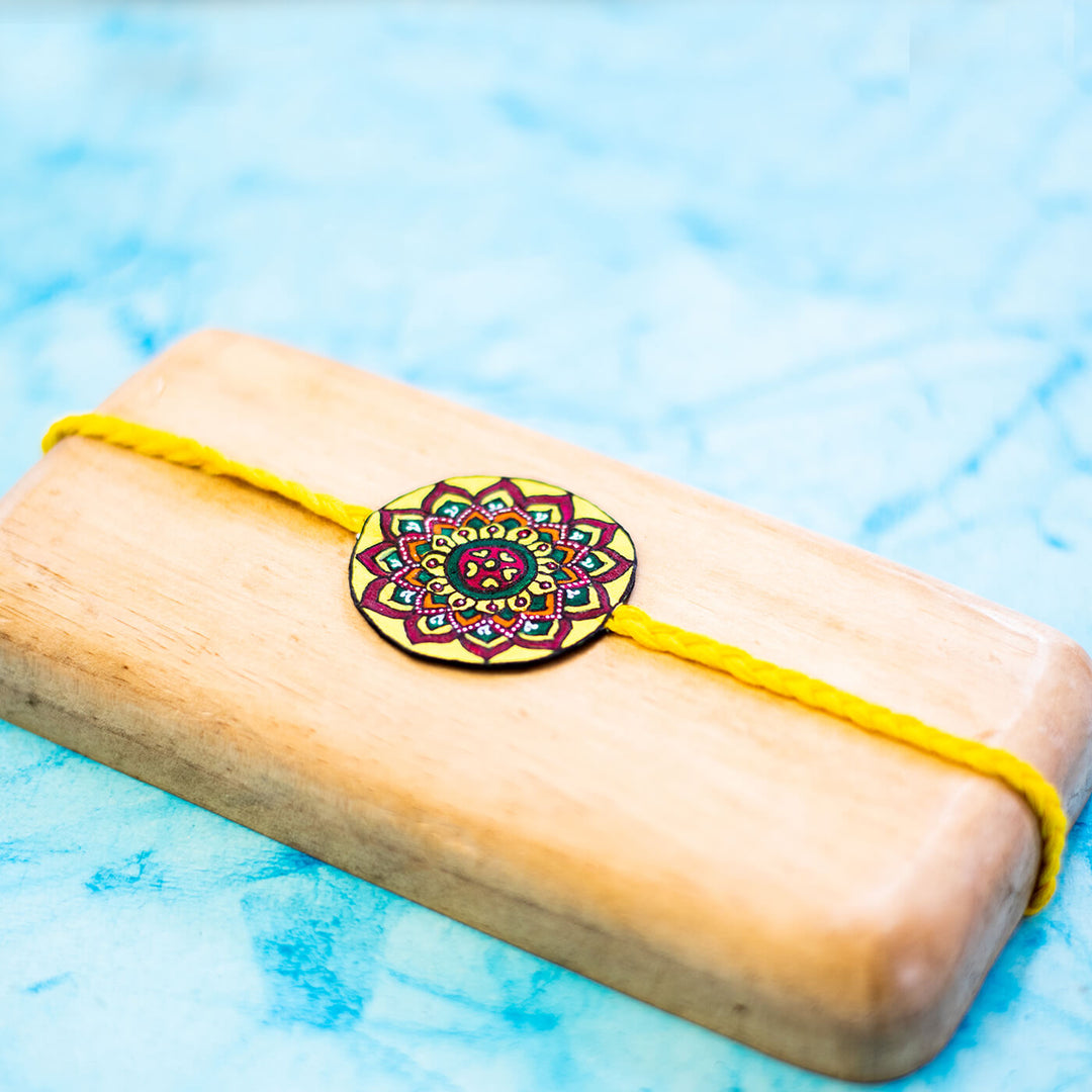 Hand-painted Eco-friendly Seed Rakhi with Roli Chawal - Yellow