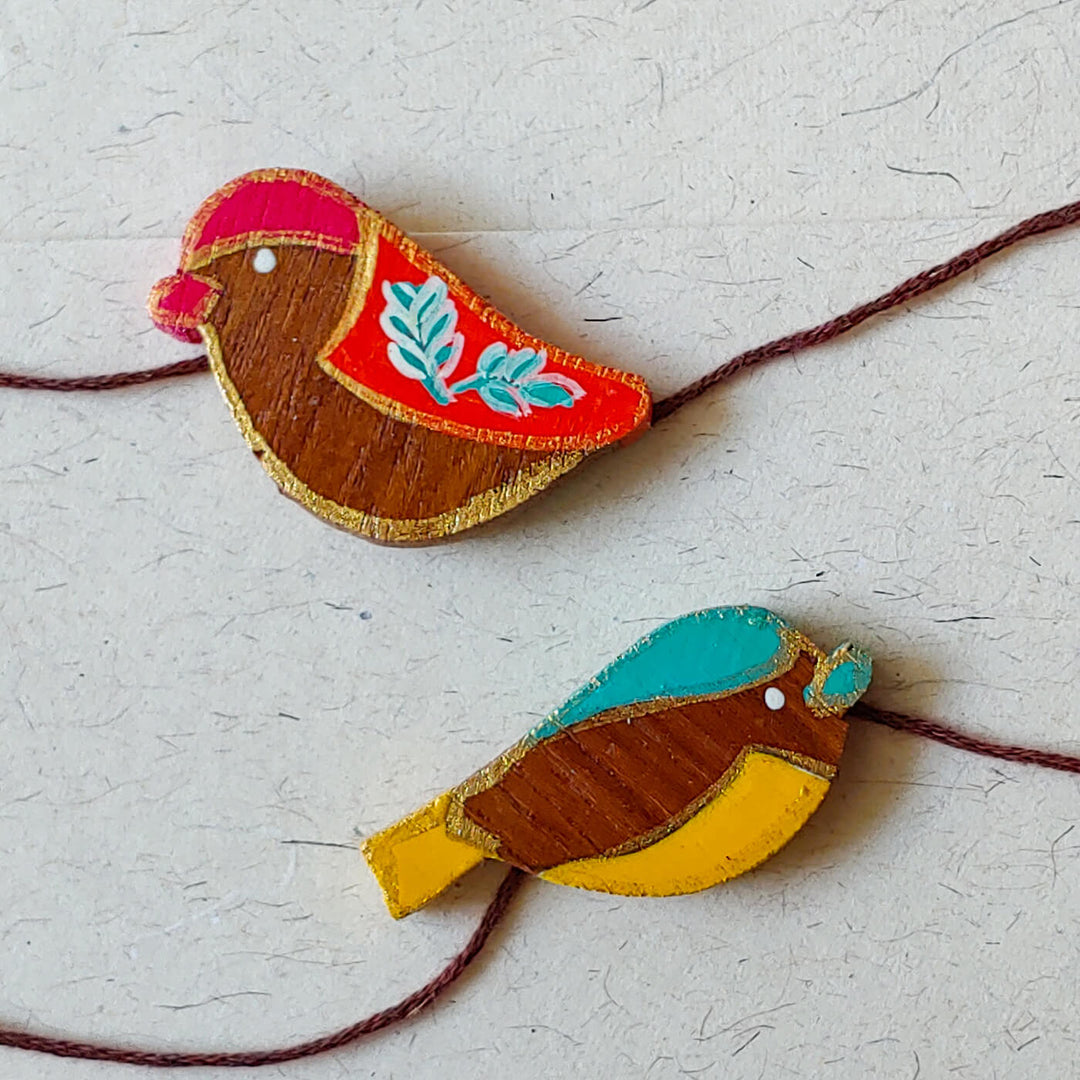 Handpainted Wooden Rakhi Set Of 2 Mini Birds - Close-up of bird designs