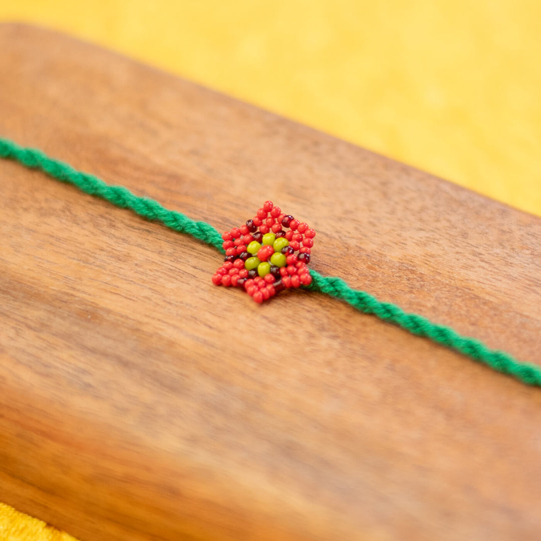 Phool Collection Glass Beeds Rakhi Green Red - Close-up of Beaded Decoration