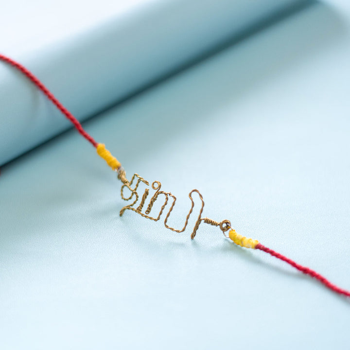 Personalized Brass Lettering Rakhi With Roli Chawal