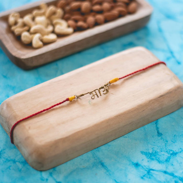 Personalized Brass Lettering Rakhi With Roli Chawal