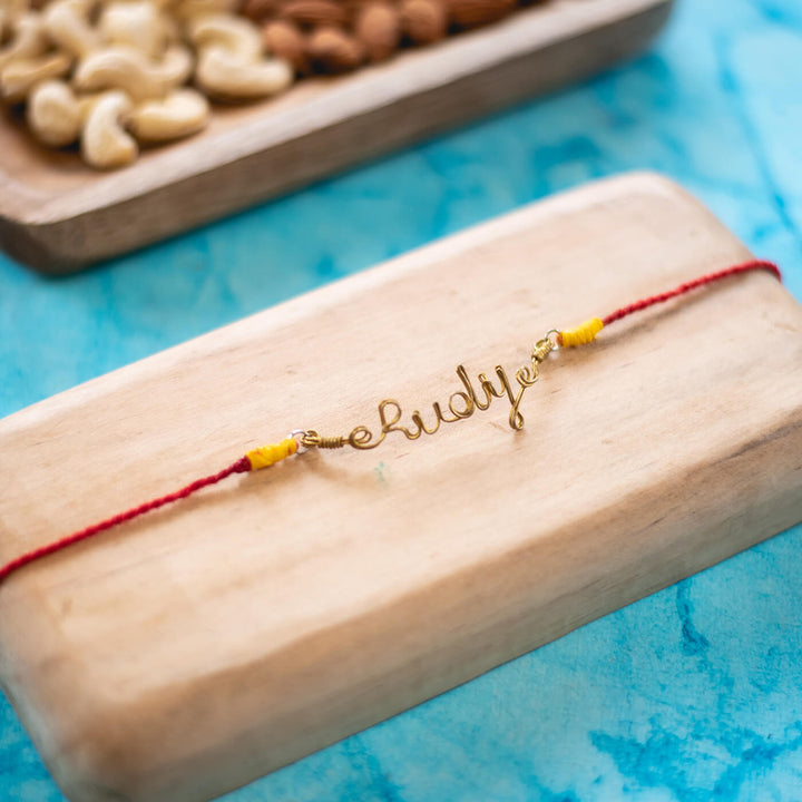 Personalized Brass Lettering Rakhi With Roli Chawal