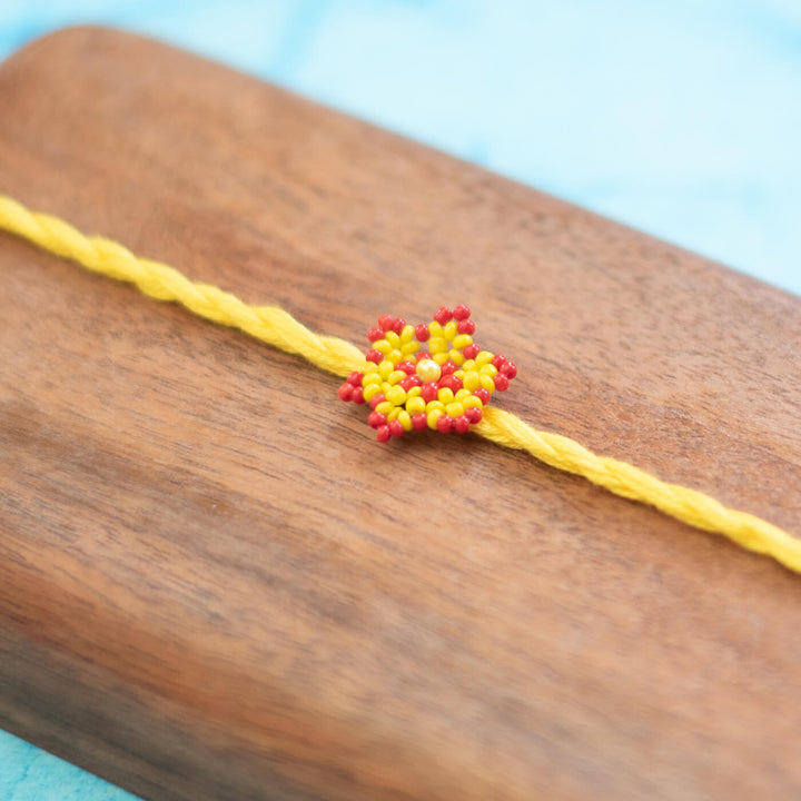 Phool Collection Glass Beeds Rakhi Yellow Red - Close-up Bead Work Detail