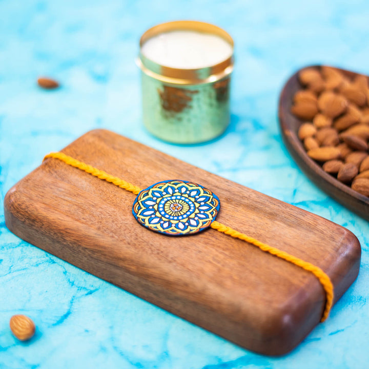 Hand-painted Eco-friendly Seed Rakhi with Roli Chawal - Orange