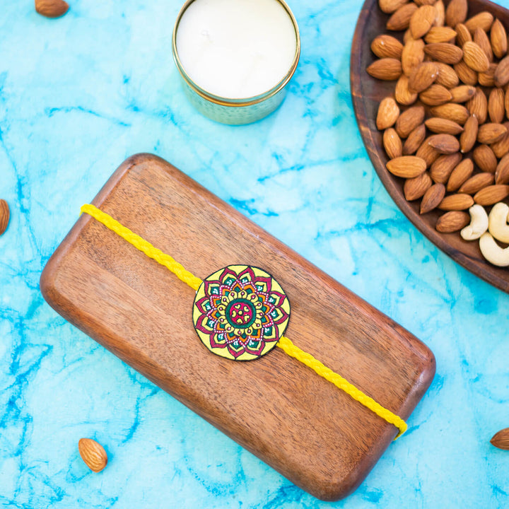 Hand-painted Eco-friendly Seed Rakhi with Roli Chawal - Yellow