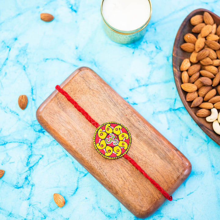 Hand-painted Eco-friendly Seed Rakhi with Roli Chawal - Red