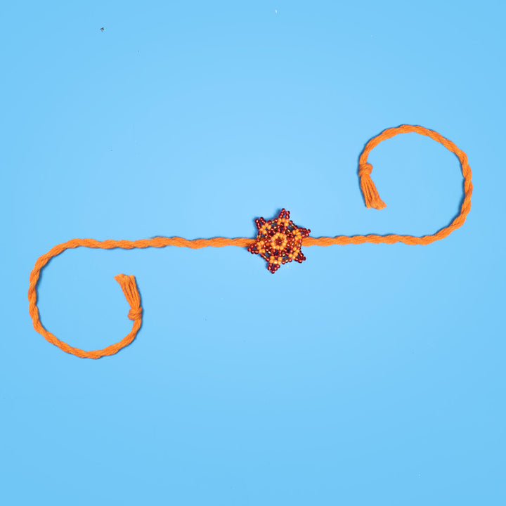 Sitara Collection Glass Beeds Rakhi Orange Red - Full Product Laid Flat