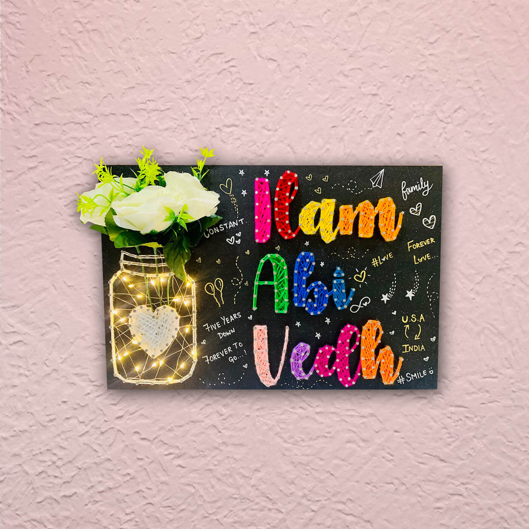 Mason Jar String Art Family Name Plate With Doodles - Mounted on Textured Wall Close-up