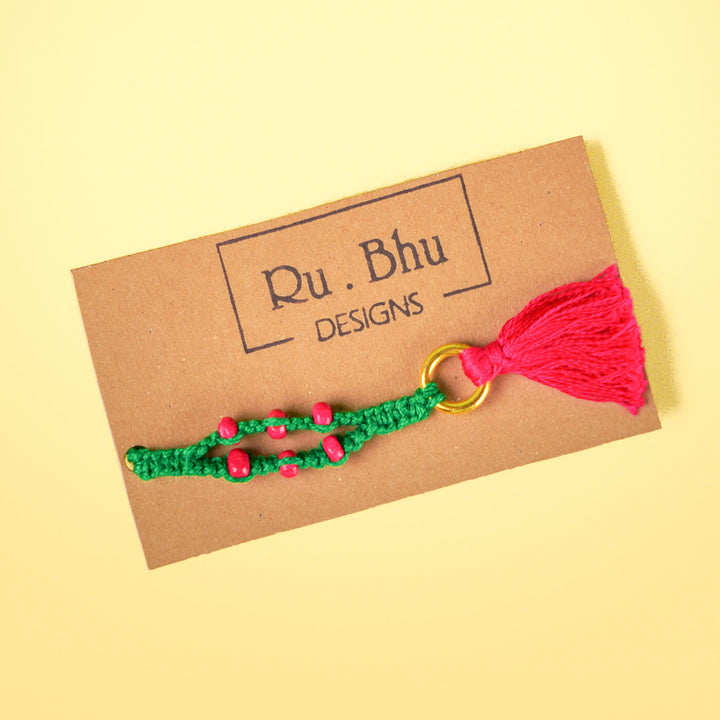 Green Macrame Cotton Rakhi With Pink Beads Tassle - Bracelet on branded card backing