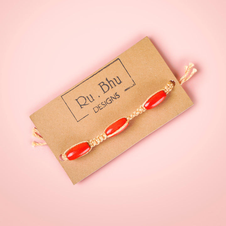Pink Macrame Cotton Rakhi With Red Beads - Bracelet on branded card