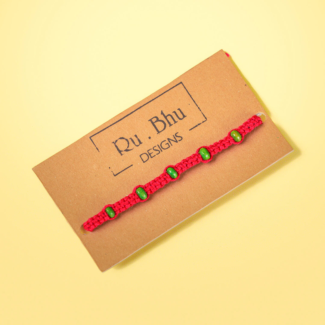 Red Macrame Cotton Rakhi With Green Beads - Packaged on Branded Card