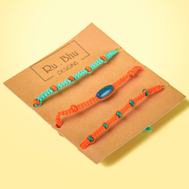 Orange Teal Rakhi With Beads Set Of 4 - Braclets on branded display card
