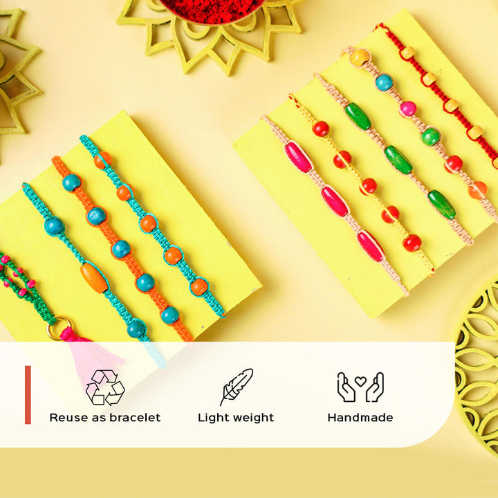 Teal Macrame Cotton Rakhi With Orange Beads - Multiple bracelets displayed flat