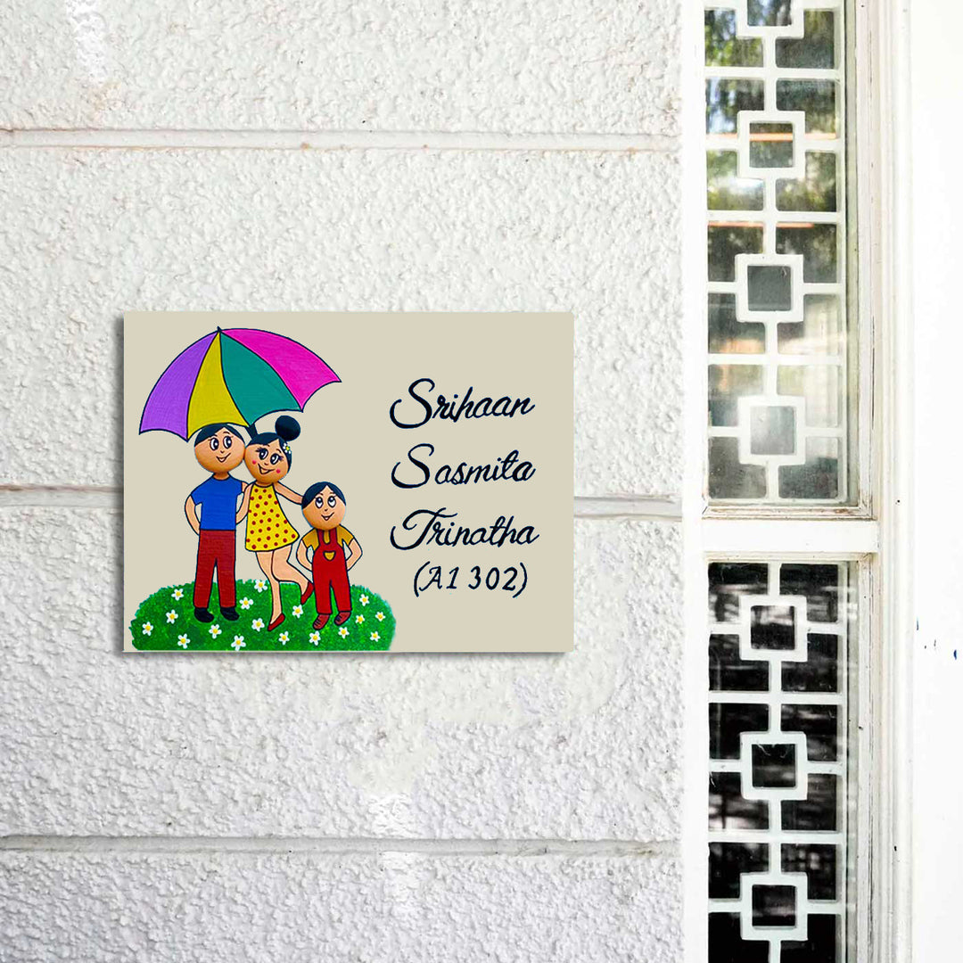 Handpainted Clay Pebble Name Plate For Family 4 - Mounted on White Wall Next to Window