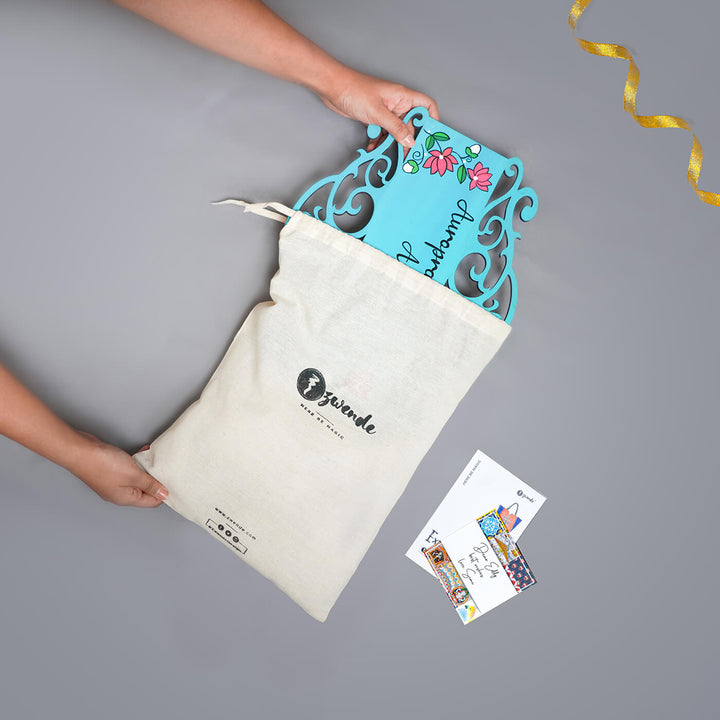 Teal Madhubani Circle Name Plate With Yellow Fish Design - Drawstring Bag Packaging Display