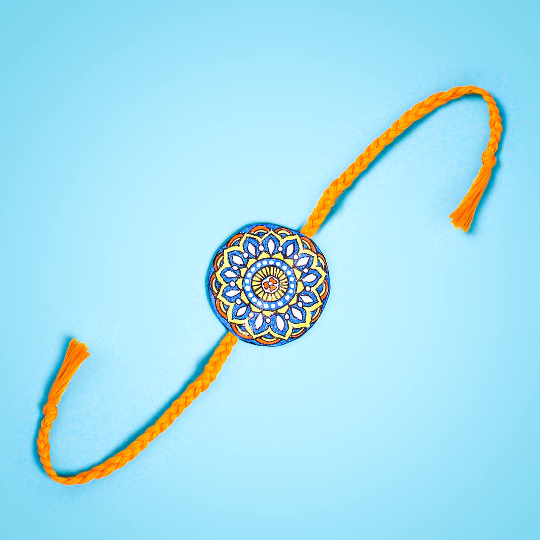 Hand-painted Eco-friendly Seed Rakhi with Roli Chawal - Orange