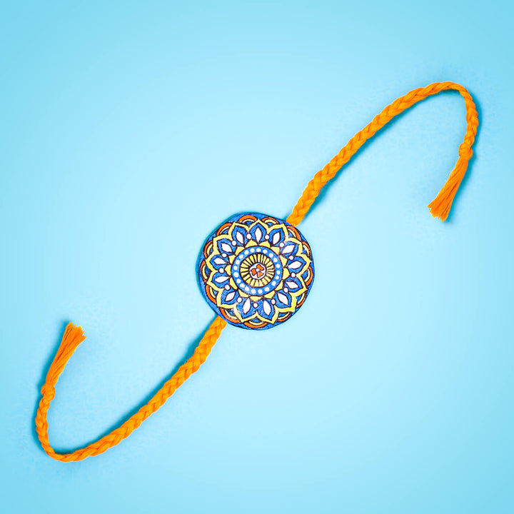 Hand-painted Eco-friendly Seed Rakhi with Roli Chawal - Orange