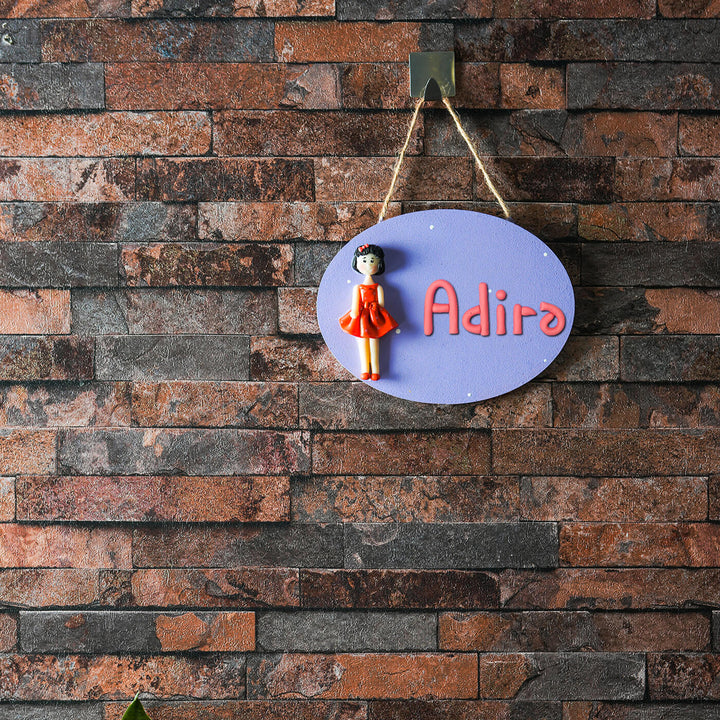 Clay Name Plate For Kids Little Girl - Hanging on Hook Against Brick Wall