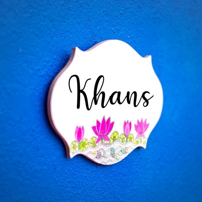 Madhubani Lotus Design Oval Cut Name Plate - Mounted on Wall Angled View