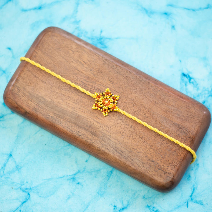 Sitara Collection Glass Beeds Rakhi Yellow Orange - Front View